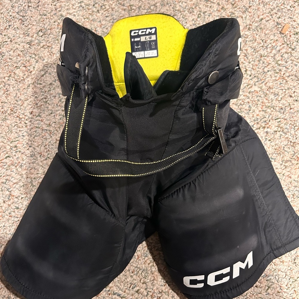 CCM tack Black Hockey Pants with Yellow Liner - youth large